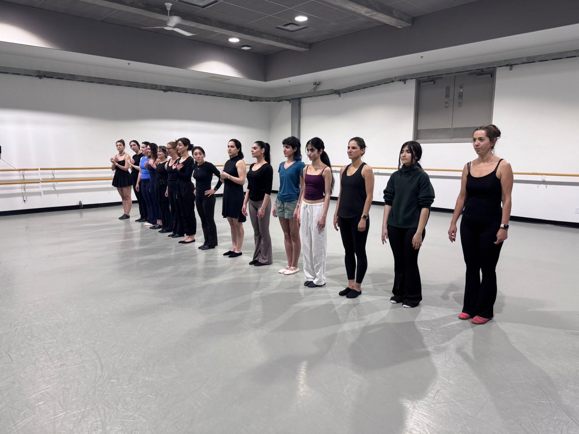 Dancers lined up at the barre