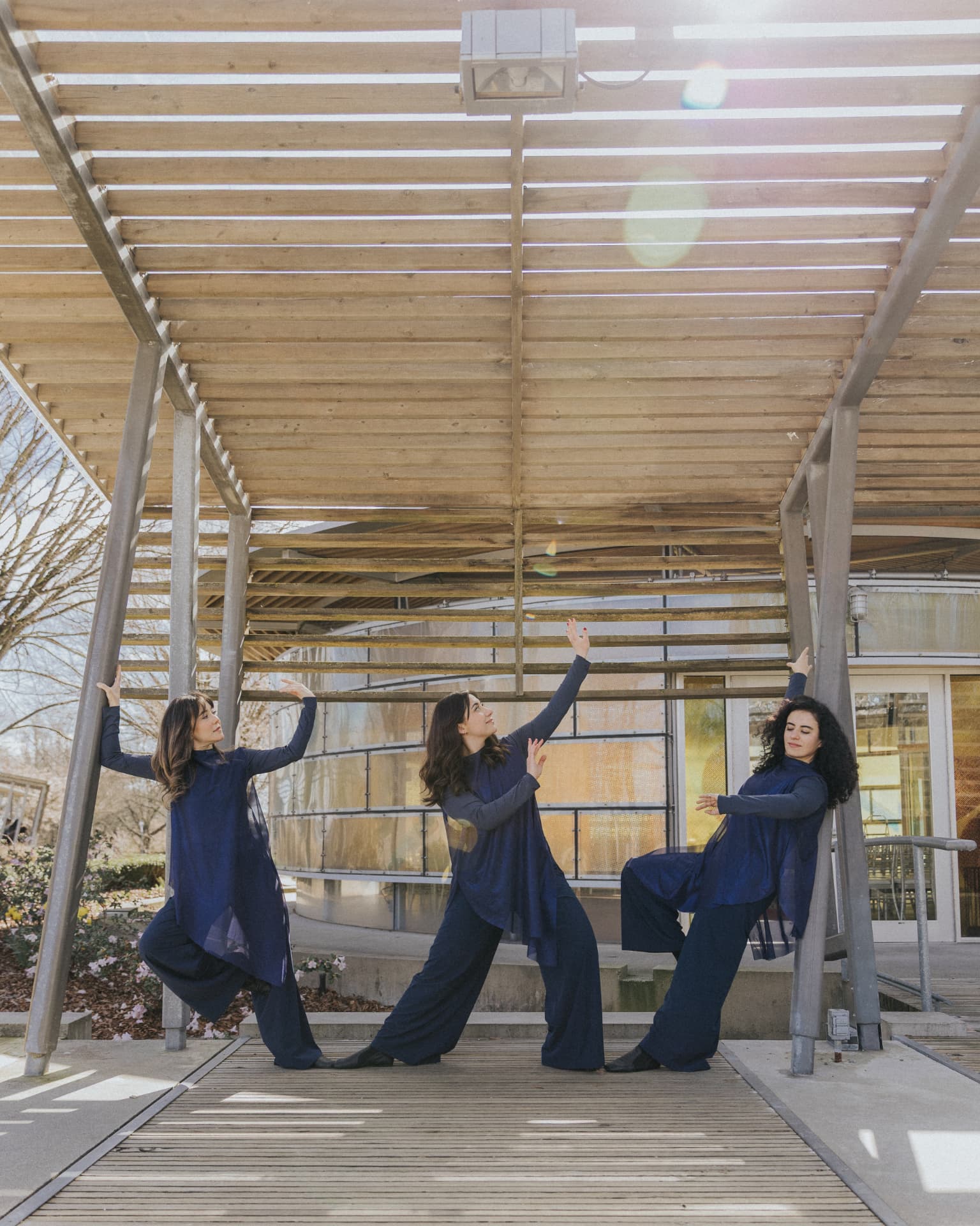 Dancers outdoors under a pergola